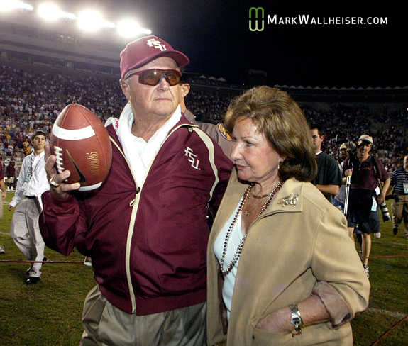 Coach Bowden and wife Ann walk across the field the night he became the winningest active Division 1 coach of all time in October of 2003.