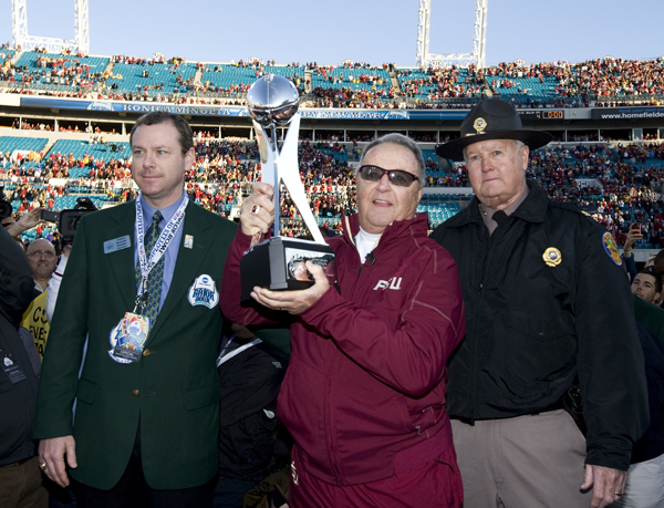 Bobby Bowden hoists his last trophy after the Gator Bowl.